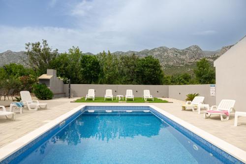 Apartments Zanic with private swimming pool and sea view