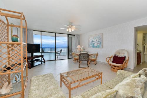 a living room with a view of the ocean at Valley Isle 905 in Kahana