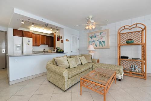 a living room with a couch and a table at Valley Isle 905 in Kahana