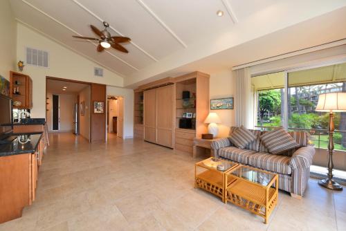 a living room with a couch and a table at Maui Kaanapali Villas #D271 in Lahaina