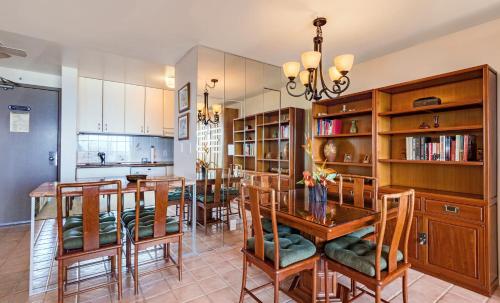 a kitchen and dining room with a table and chairs at Valley Isle #205 in Kahana