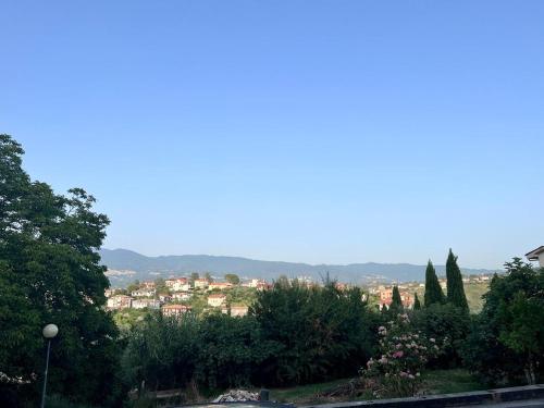 a view of a town from a hill with trees at Casa Dei Cavalieri in Cosenza