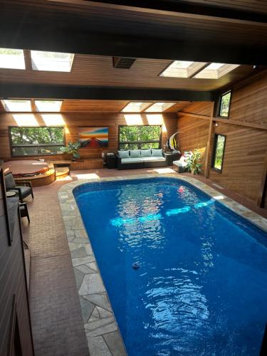 a large swimming pool in a house at Indoor pool, hot tub, sauna! in Colorado Springs