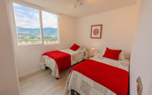 Ένα ή περισσότερα κρεβάτια σε δωμάτιο στο Oceana Suites Papudo