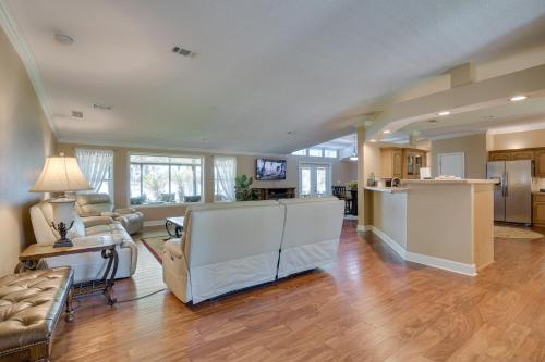 a large living room with a couch and a table at Waterfront Georgetown Retreat on Lake George! in Georgetown