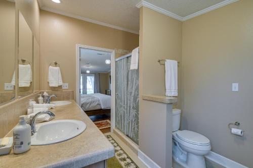a bathroom with a sink and a toilet at Waterfront Georgetown Retreat on Lake George! in Georgetown