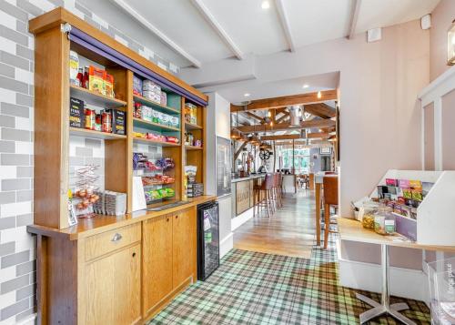 a grocery store with a counter and a pharmacyacistacistacistacistacist at Bath Mill Lodge Retreat in Bath