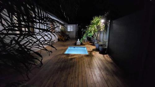 a dark room with a swimming pool in a house at Villa Ananda in Cilaos