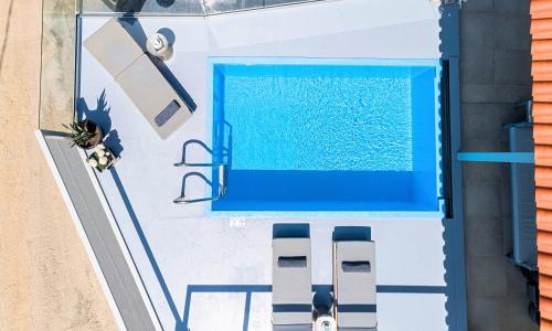 an overhead view of a swimming pool on a boat at Olive Green Villa Heated Pool in Agios Nikolaos
