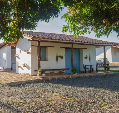 a house with a picnic table in front of it at Trinitarios in Barichara