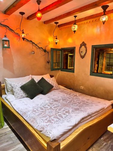 a bedroom with a large bed in a room at Apartman Tuareg in Sarajevo