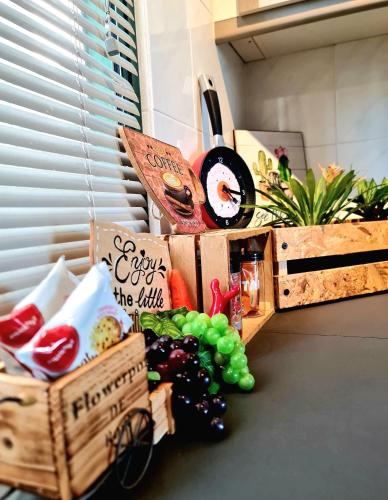a display of food and vegetables in wooden crates at Melaka Relax Home - 6 pax - SeaView corner unit - 6 min to Historical Spot & Jonker in Melaka