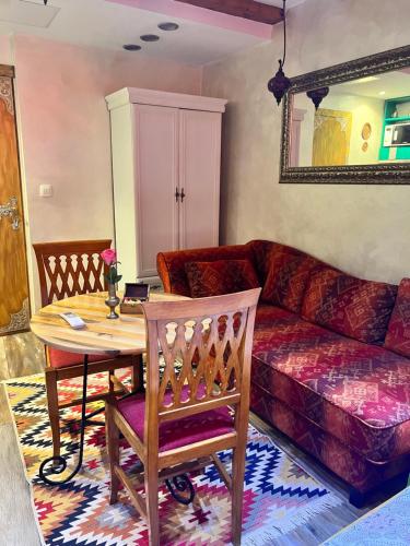 a living room with a couch and a table at Apartman Tuareg in Sarajevo