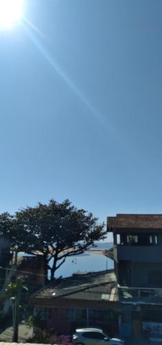 a view of a city with a tree and buildings at APARTAMENTO BARRA DO JUCU VISTA MAR in Vila Velha