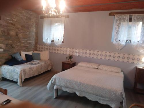 En eller flere senge i et værelse på Segarati Relax La Maiolica