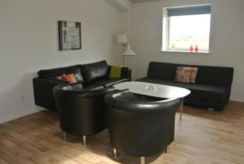 Zona de estar de Fitting Landsbyferie Apartments
