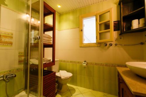 a bathroom with a shower and a toilet and a sink at Sunny Apartment with Fabulous Sea View in Alanya