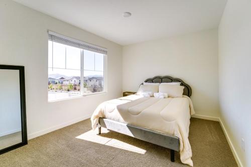 a bedroom with a bed and a window at Modern Reno Vacation Home Easy Access to Nature in Reno