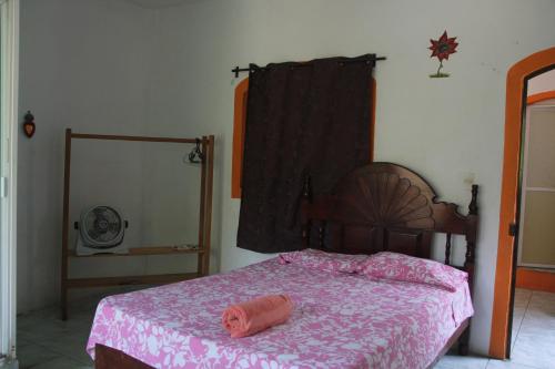 En eller flere senge i et værelse på Casa Galindo