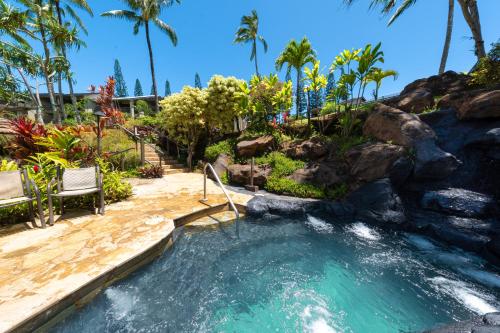 a hot tub with a waterfall in a resort at Hanalei Bay Resort in Princeville