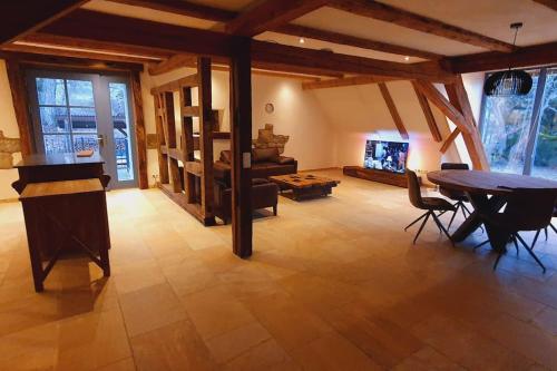 a large living room with a table and a couch at Apartment Luna in Creglingen