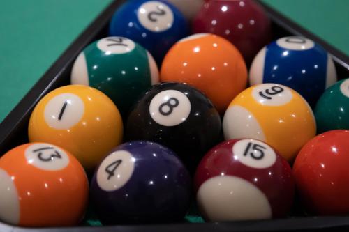 a group of billiard balls in a pool table at HOTEL POSADA LaS RETAJAS in Medinaceli