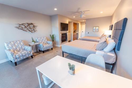 a living room with a bed and a living room with a couch at Baywood Inn Bed & Breakfast in Los Osos