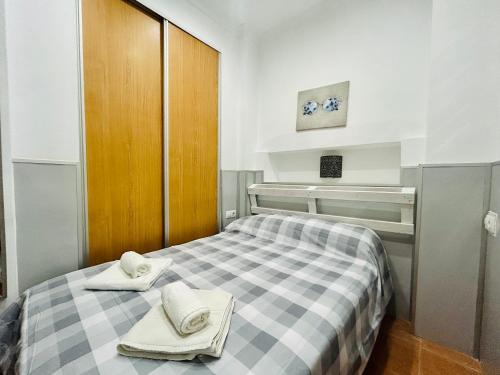 Säng eller sängar i ett rum på Bajondillo Apartment