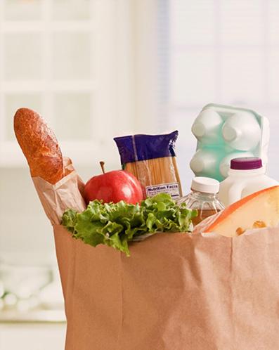 a paper bag filled with food and an apple at Residence Inn Columbia Northeast/Fort Jackson Area in Columbia