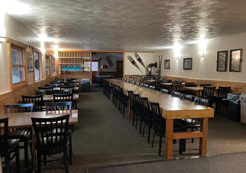 a room with rows of tables and chairs at Trailshead Lodge - Cabin 4 in Lead