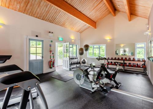 a gym with several exercise bikes in a room at Bath Mill Lodge Retreat in Bath