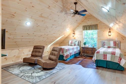 a bedroom with two beds and a ceiling fan at Serene Kentucky Cabin with Fireplace and Fire Pit! in Williamstown