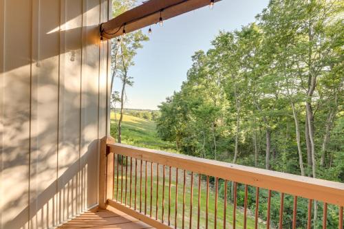 a balcony with a view of the woods at Serene Kentucky Cabin with Fireplace and Fire Pit! in Williamstown