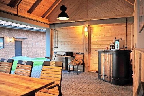a patio with a bar and a table and chairs at Mazury Haus in Ruciane-Nida