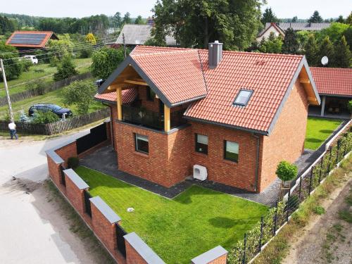 an overhead view of a house with a roof at Mazury Haus in Ruciane-Nida
