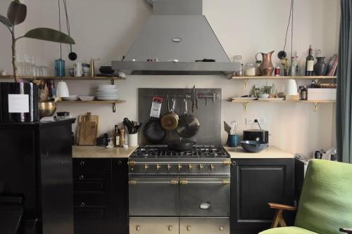 a kitchen with an oven and a stove top at Bright apartment - near Place Pigalle in Paris