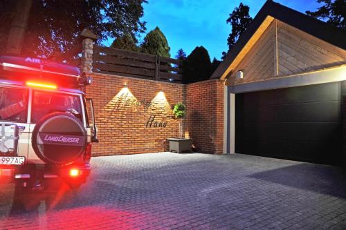 a fire truck parked in front of a garage at Mazury Haus in Ruciane-Nida