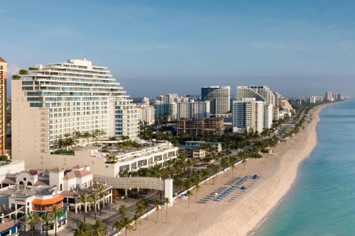 a view of a beach with buildings and the ocean at The Ritz-Carlton, Fort Lauderdale in Fort Lauderdale