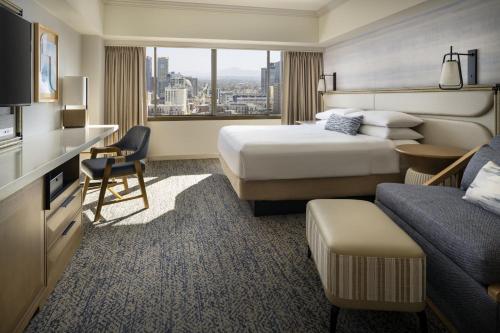 a hotel room with two beds and a desk at Marriott Marquis San Diego Marina in San Diego
