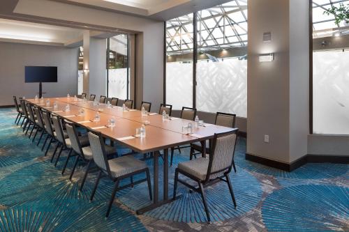 a conference room with a long table and chairs at Crystal Gateway Marriott in Arlington