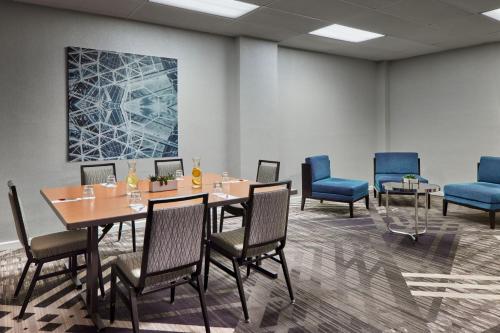 a conference room with a table and chairs at Crystal Gateway Marriott in Arlington