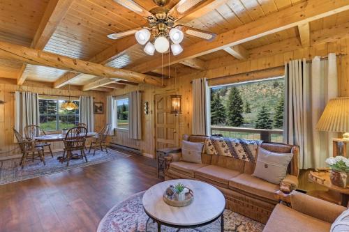 a living room with a couch and a table at River Gem in Creede