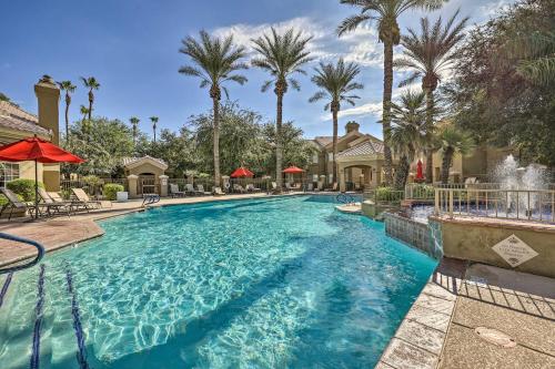 a swimming pool at a resort with palm trees at Lovely Estero Condo Community Perks and Pool Access in Estero