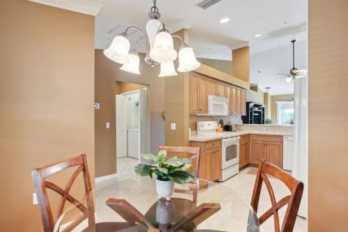 a kitchen with a dining room table and chairs at Lovely Estero Condo Community Perks and Pool Access in Estero