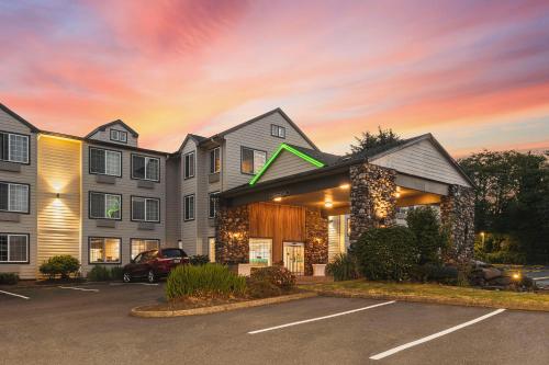 a rendering of a hotel with a parking lot at The Ashley Inn & Suites in Lincoln City
