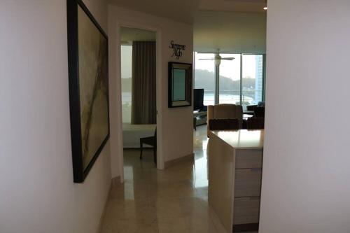 a hallway with a living room and a dining room at 07D Great Value Luxury Resort Beachfront Oceanview in ArraijÃ¡n