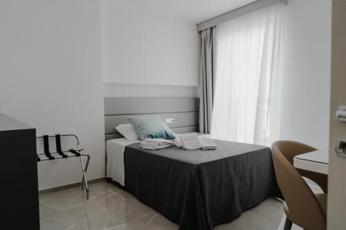 Postel nebo postele na pokoji v ubytování RIMIR Hotel & Centro Benessere