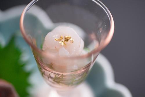 a glass cup with a dessert in it at Tanakaya in Kurobe