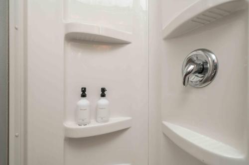 a bathroom door with two bottles on a shelf at Grand Palace in Sioux Falls