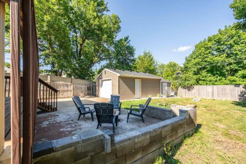 a patio with chairs and a table in a yard at Grand Palace in Sioux Falls